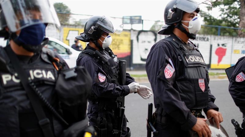 Photo: Riot police preparing to contain people who were detained for violating El Salvador’s nationwide lockdown measures in San Salvador, El Salvador [Jose Cabezas/Reuters]